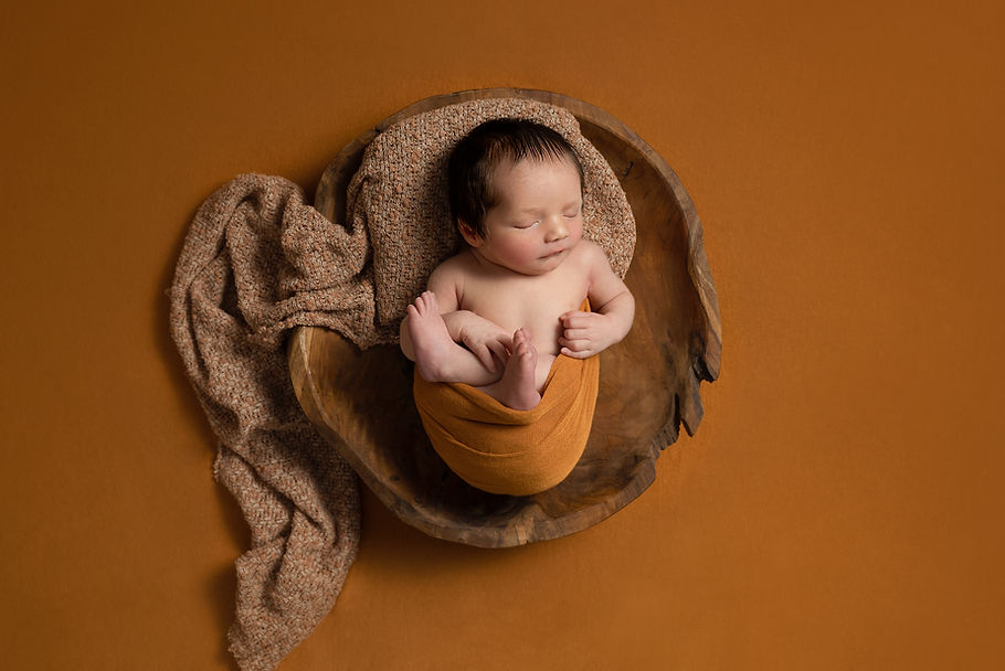 Newborn baby photoshoot on yellow Dromore Lisburn Northern Ireland